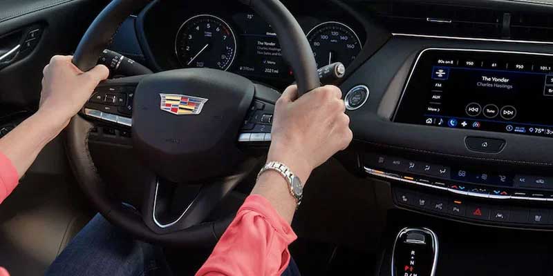 Cadillac car with dashboard gauges.