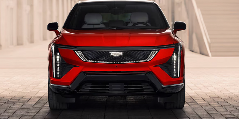Front view of red Cadillac Optiq electric SUV.